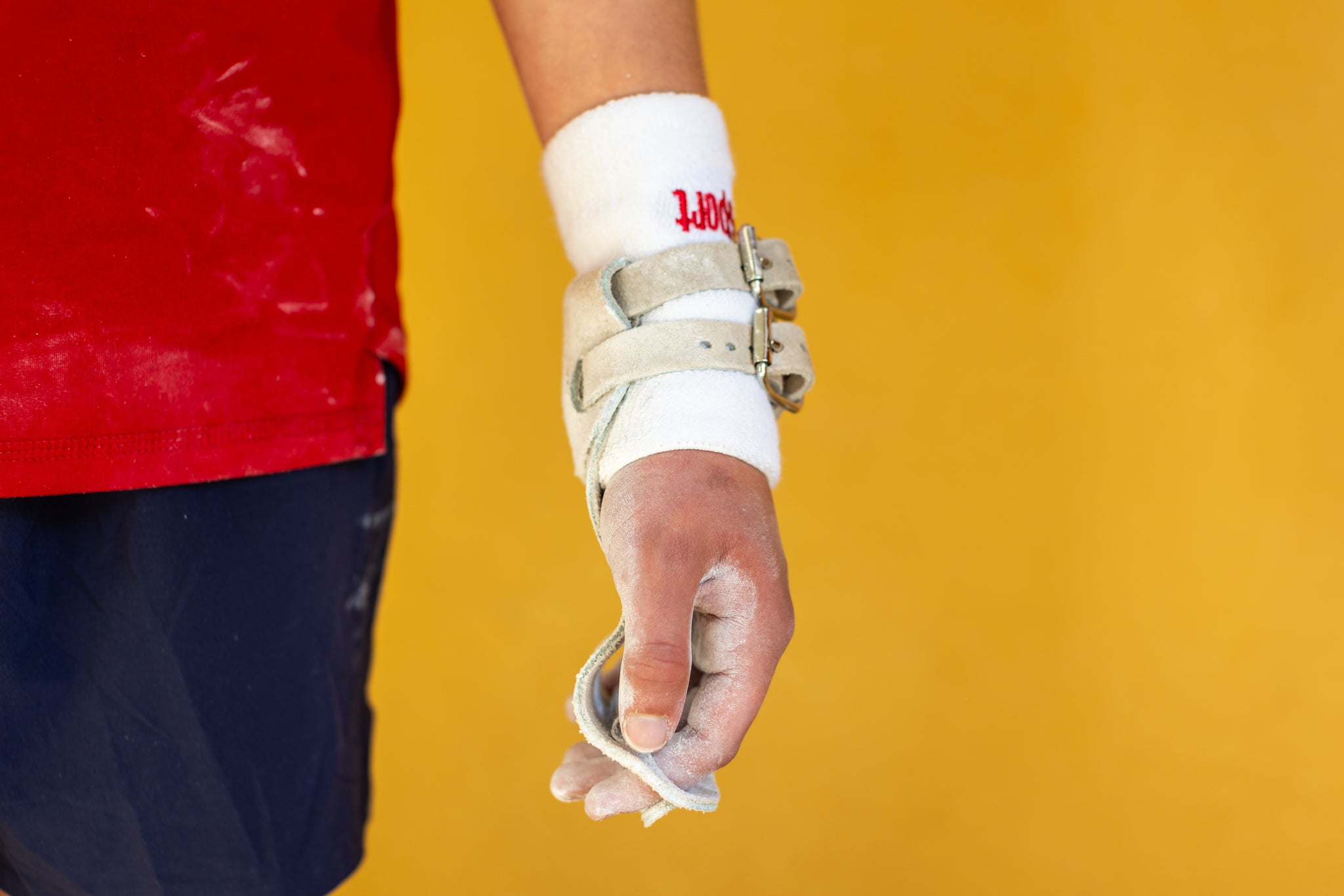 Reisport® Men's High Bar Grips - Double Buckle on hand