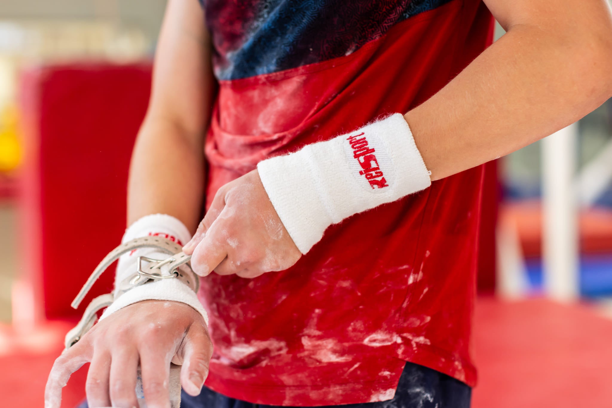 Male gymnast wearing Reisport® Men's Ring Grips - Double Buckle on hands