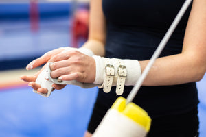 
                  
                    Load image into Gallery viewer, Female gymnast with Reisport® Women&amp;#39;s Hyper Protec Uneven Bar Grips on hands
                  
                